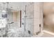 Gorgeous bathroom with a glass shower, soaking tub and marble tile at 4381 W Flamingo Rd # 1512, Las Vegas, NV 89103