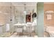 Luxurious bathroom with a glass-enclosed shower, double sinks, and elegant marble finishes at 4381 W Flamingo Rd # 1512, Las Vegas, NV 89103