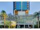 Hotel entrance with vibrant greenery and architectural signage at 4381 W Flamingo Rd # 1512, Las Vegas, NV 89103