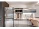 Sleek stainless steel kitchenette featuring modern appliances and a convenient breakfast bar at 4381 W Flamingo Rd # 1512, Las Vegas, NV 89103