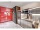 Compact kitchenette featuring modern appliances, sleek cabinetry, and a breakfast bar at 4381 W Flamingo Rd # 1512, Las Vegas, NV 89103