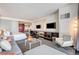 Modern living space featuring a sleek sofa, workspace, and a luxurious bed, offering a comfortable urban retreat at 4381 W Flamingo Rd # 1512, Las Vegas, NV 89103