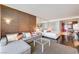 Elegant living area with a comfortable sofa, workspace, luxurious bed, and a partial kitchen at 4381 W Flamingo Rd # 1512, Las Vegas, NV 89103