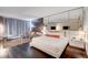 Contemporary living area featuring a spacious bed, modern sofa, and workspace, creating an inviting atmosphere at 4381 W Flamingo Rd # 1512, Las Vegas, NV 89103