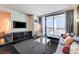 Contemporary living room with stylish furnishings and a breathtaking view of the cityscape at 4381 W Flamingo Rd # 1512, Las Vegas, NV 89103
