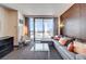 Modern living room with a sleek sofa, glass table, and expansive windows offering views of the Palms Casino Resort at 4381 W Flamingo Rd # 1512, Las Vegas, NV 89103