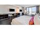 Bright and airy main bedroom featuring a desk area, hardwood floors, and a balcony with city views at 4381 W Flamingo Rd # 1512, Las Vegas, NV 89103