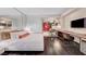 Chic studio apartment with a plush bed, sleek workspace, modern kitchen, and hardwood floors for stylish living at 4381 W Flamingo Rd # 1512, Las Vegas, NV 89103