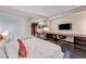 Bright studio apartment featuring a comfortable bed, modern kitchen, and functional workspace at 4381 W Flamingo Rd # 1512, Las Vegas, NV 89103