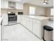 Modern kitchen featuring stainless steel appliances, white cabinets, and a long island at 4420 Rich Dr # B, Las Vegas, NV 89102