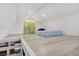 Lofted attic bedroom space illuminated by recessed lighting, painted in neutral colors to create a serene retreat at 4490 W Warm Springs Rd, Las Vegas, NV 89118