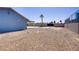 Spacious backyard features desert landscaping and block wall at 4490 W Warm Springs Rd, Las Vegas, NV 89118