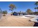 Large backyard with pool, desert landscaping, and mature trees at 4490 W Warm Springs Rd, Las Vegas, NV 89118