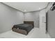 Comfortable bedroom featuring an attached bathroom and marble floors throughout at 4490 W Warm Springs Rd, Las Vegas, NV 89118