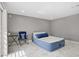 Bright bedroom with marble floors, a patio door to the back yard, and minimalist decor at 4490 W Warm Springs Rd, Las Vegas, NV 89118
