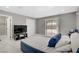 Comfortable bedroom with natural light, marble floors, and neutral walls, creating a serene atmosphere at 4490 W Warm Springs Rd, Las Vegas, NV 89118