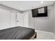Bedroom featuring a TV and an attached bathroom with tiled shower and marble floors at 4490 W Warm Springs Rd, Las Vegas, NV 89118
