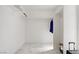 A clean and organized walk-in closet with ample space for storage and marble flooring at 4490 W Warm Springs Rd, Las Vegas, NV 89118