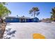 Beautiful home with solar panels, large driveway, complemented by mature landscaping at 4490 W Warm Springs Rd, Las Vegas, NV 89118