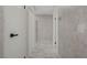 Hallway features marble floors, neutral walls, and updated lighting at 4490 W Warm Springs Rd, Las Vegas, NV 89118