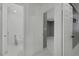Hallway view into bathroom and bedroom. Neutral paint and marble floors throughout at 4490 W Warm Springs Rd, Las Vegas, NV 89118