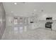 Bright and modern living room with kitchen, fireplace, and lots of natural light at 4490 W Warm Springs Rd, Las Vegas, NV 89118