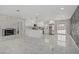 Bright living room boasts a fireplace, open floor plan, and modern white cabinets at 4490 W Warm Springs Rd, Las Vegas, NV 89118
