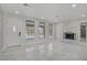 Bright living room boasts a fireplace and lots of natural light at 4490 W Warm Springs Rd, Las Vegas, NV 89118