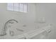 A detailed view of the walk-in tub featuring easy access, safety features, and a comfortable seating arrangement at 4490 W Warm Springs Rd, Las Vegas, NV 89118