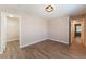 Neutral bedroom with wood-look flooring, closet, and modern ceiling fan at 455 Westminster Hall Ave # 101, North Las Vegas, NV 89032