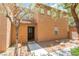 Charming two-story home with a stucco exterior, desert landscaping, and a welcoming entryway at 455 Westminster Hall Ave # 101, North Las Vegas, NV 89032