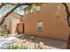 Side view of stucco exterior and well kept grounds at 455 Westminster Hall Ave # 101, North Las Vegas, NV 89032