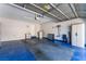 Spacious garage with epoxy floors and ample storage cabinets at 455 Westminster Hall Ave # 101, North Las Vegas, NV 89032