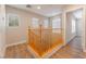 Hallway area showcasing wood flooring and access to the staircase, perfect for navigation at 455 Westminster Hall Ave # 101, North Las Vegas, NV 89032