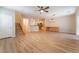 Open-concept living space featuring stylish flooring, wood cabinets and an open layout to the kitchen at 455 Westminster Hall Ave # 101, North Las Vegas, NV 89032