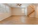 Spacious living area with stylish flooring, large windows, and a staircase with wood railing at 455 Westminster Hall Ave # 101, North Las Vegas, NV 89032