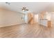 Spacious living area with stylish flooring, large windows, and a staircase with wood railing at 455 Westminster Hall Ave # 101, North Las Vegas, NV 89032