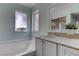 Bathroom featuring a tub with shower fixture and white vanity at 4742 Obannon Dr # A, Las Vegas, NV 89102
