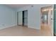 Bedroom with tile flooring, sliding closet door, and neutral walls at 4742 Obannon Dr # A, Las Vegas, NV 89102