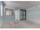 Light-filled bedroom with built-in shelves, a window, and neutral carpet flooring at 4742 Obannon Dr # A, Las Vegas, NV 89102