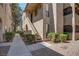 Attractive condo exterior featuring well-maintained landscaping, stucco facade, and inviting walkway at 4742 Obannon Dr # A, Las Vegas, NV 89102