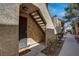 Exterior shot featuring the front entrance with stucco finish, stairs, and landscaping at 4742 Obannon Dr # A, Las Vegas, NV 89102