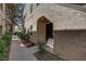 Building featuring a gated entrance and neutral stucco finish. Sidewalk in front at 4742 Obannon Dr # A, Las Vegas, NV 89102