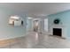 Inviting living room with tiled floors, fireplace, and a pass-through to the kitchen at 4742 Obannon Dr # A, Las Vegas, NV 89102