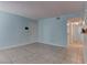 Bright living room with tiled floors, neutral walls, and a spacious layout at 4742 Obannon Dr # A, Las Vegas, NV 89102