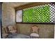 An enclosed patio provides a cozy outdoor seating area with views of lush greenery at 4742 Obannon Dr # A, Las Vegas, NV 89102