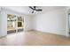Bright bedroom featuring sliding glass doors to the backyard and light hardwood flooring at 5069 Hallet Dr, Las Vegas, NV 89122