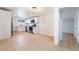 Bright kitchen featuring modern stainless steel appliances, white cabinets, and ample countertop space at 5069 Hallet Dr, Las Vegas, NV 89122