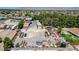 Aerial view displaying a property with multiple structures, expansive parking, and surrounding vegetation in a residential area at 5260 N Jones Blvd, Las Vegas, NV 89130