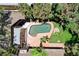 Aerial view of backyard with a pool, shaded patio, mature landscaping, and grass at 5260 N Jones Blvd, Las Vegas, NV 89130